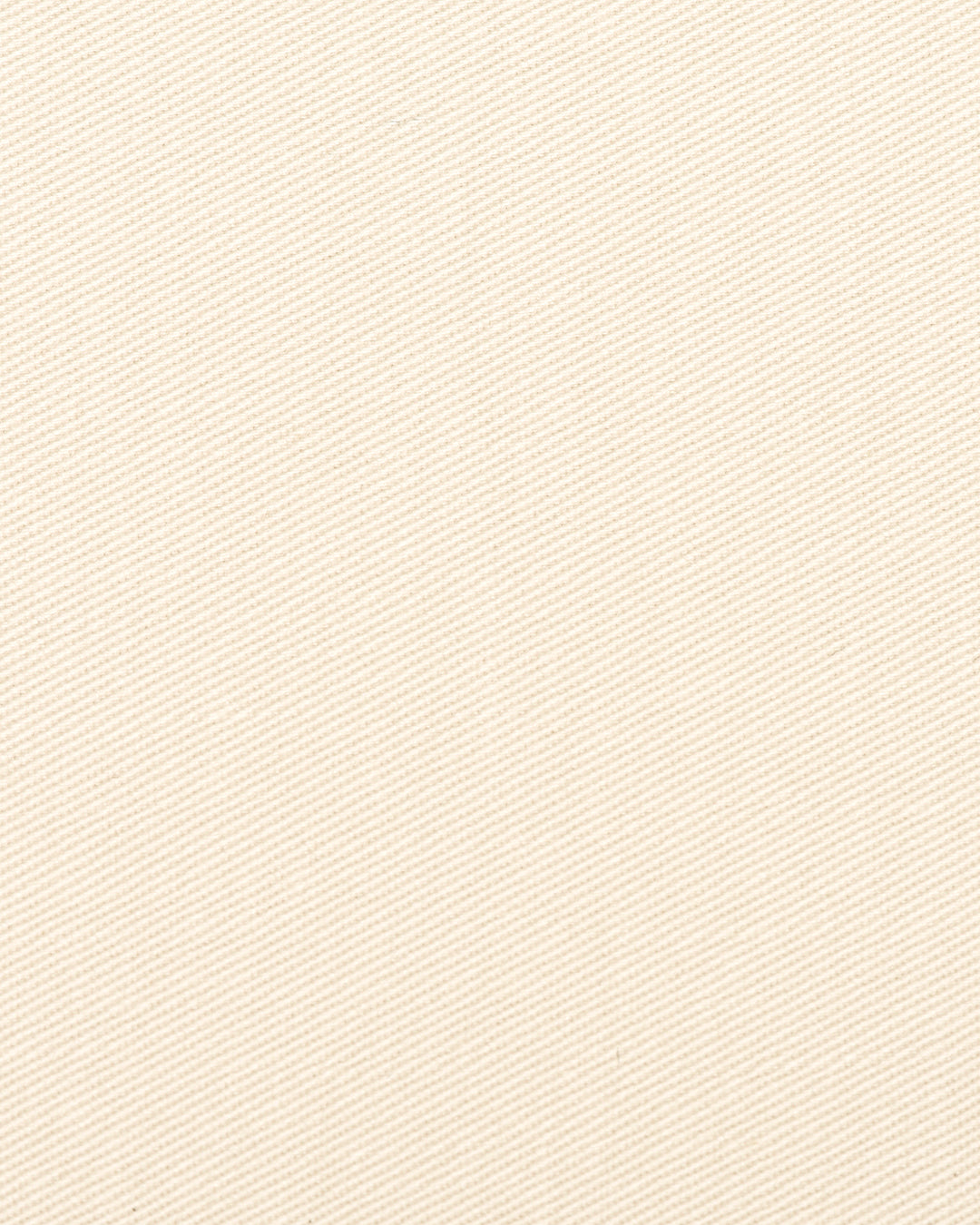 Close up view of custom Genoa Chino pants for men by Luxire in ivory cream