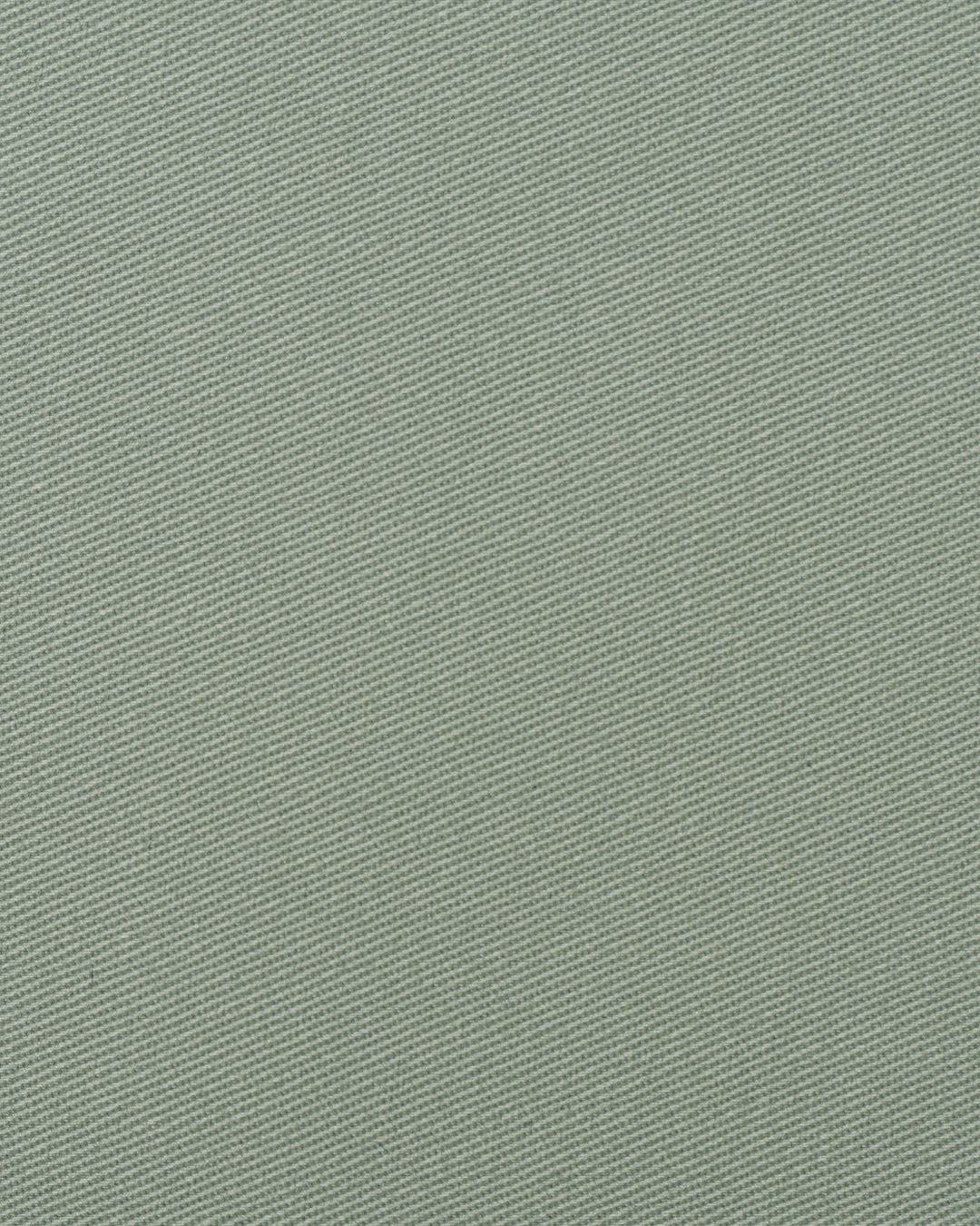 Closeup view of custom Genoa Chino pants for men by Luxire in pistachio green