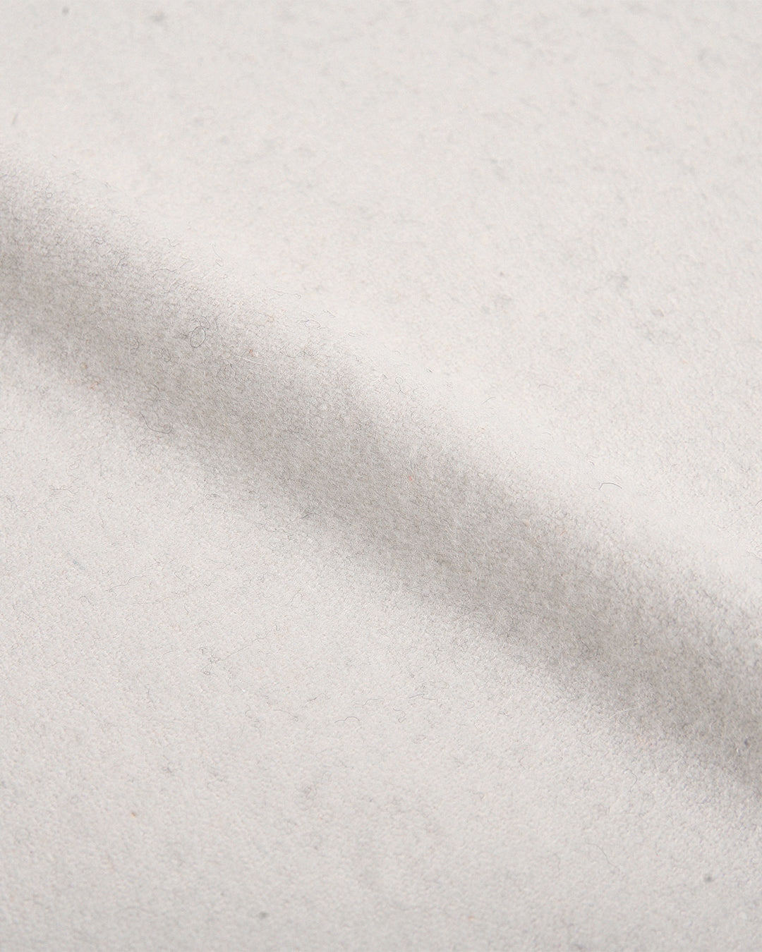 Close up view of custom wool Chino pants for men by Luxire in cream