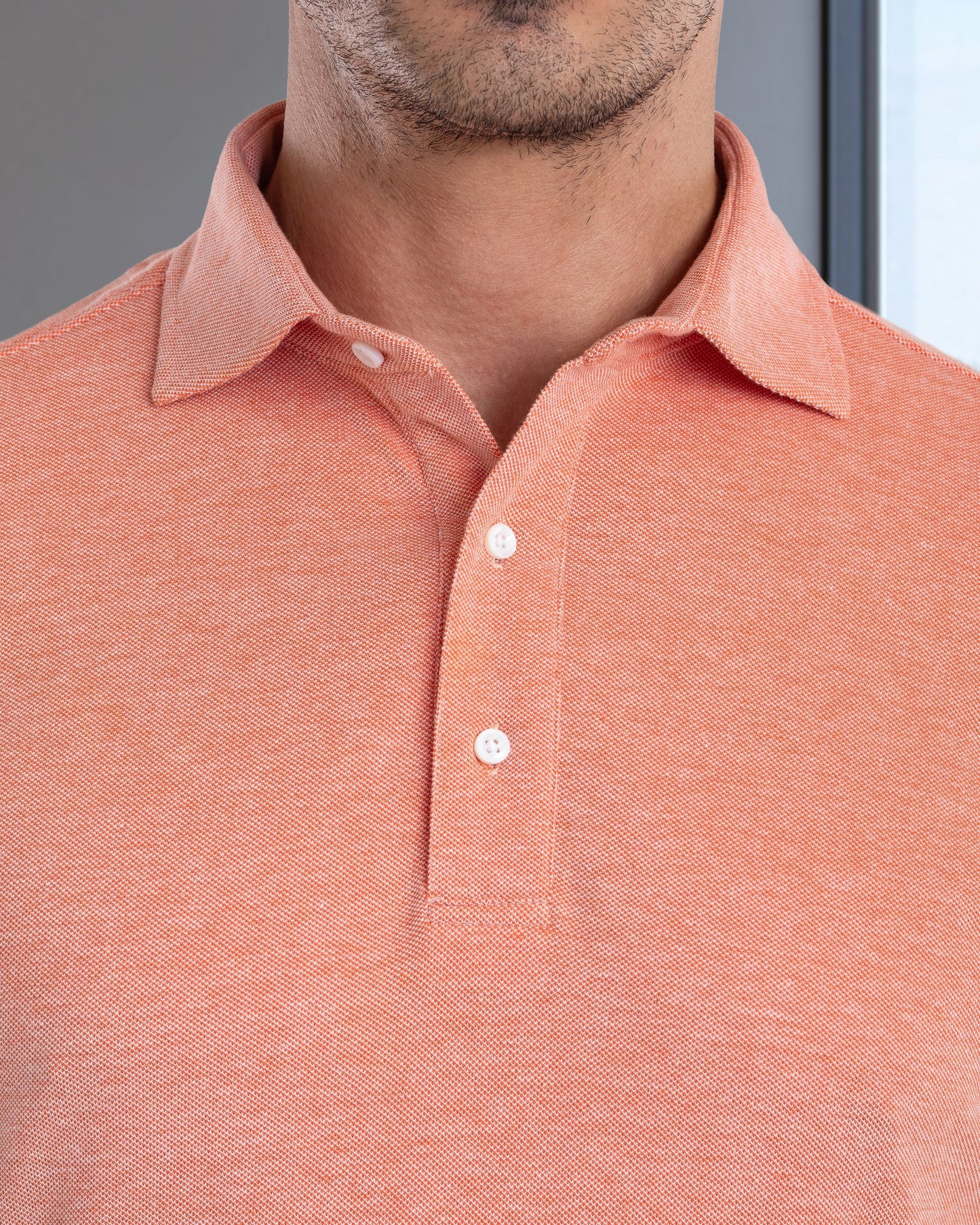 Model close up wearing mens wool jeans by Luxire in cream 2